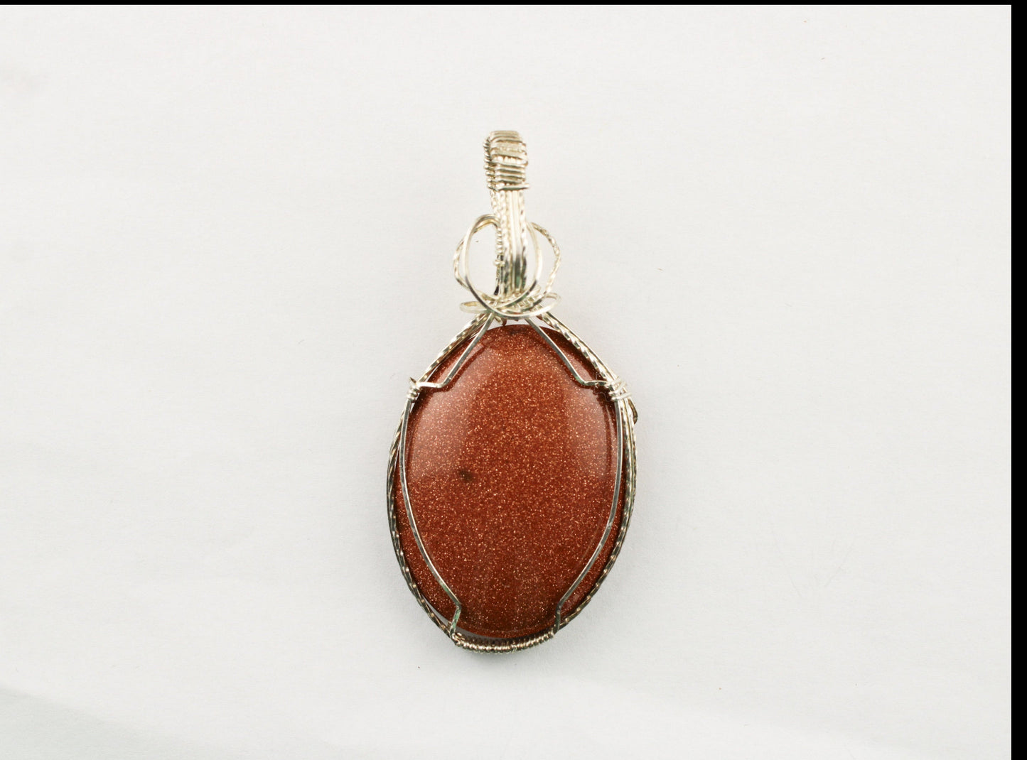 Sterling silver wrapped stone pendant