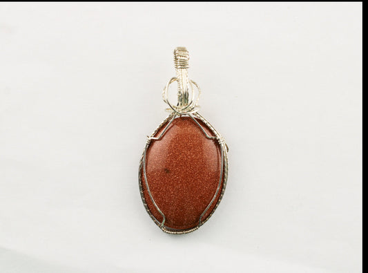 Sterling silver wrapped stone pendant