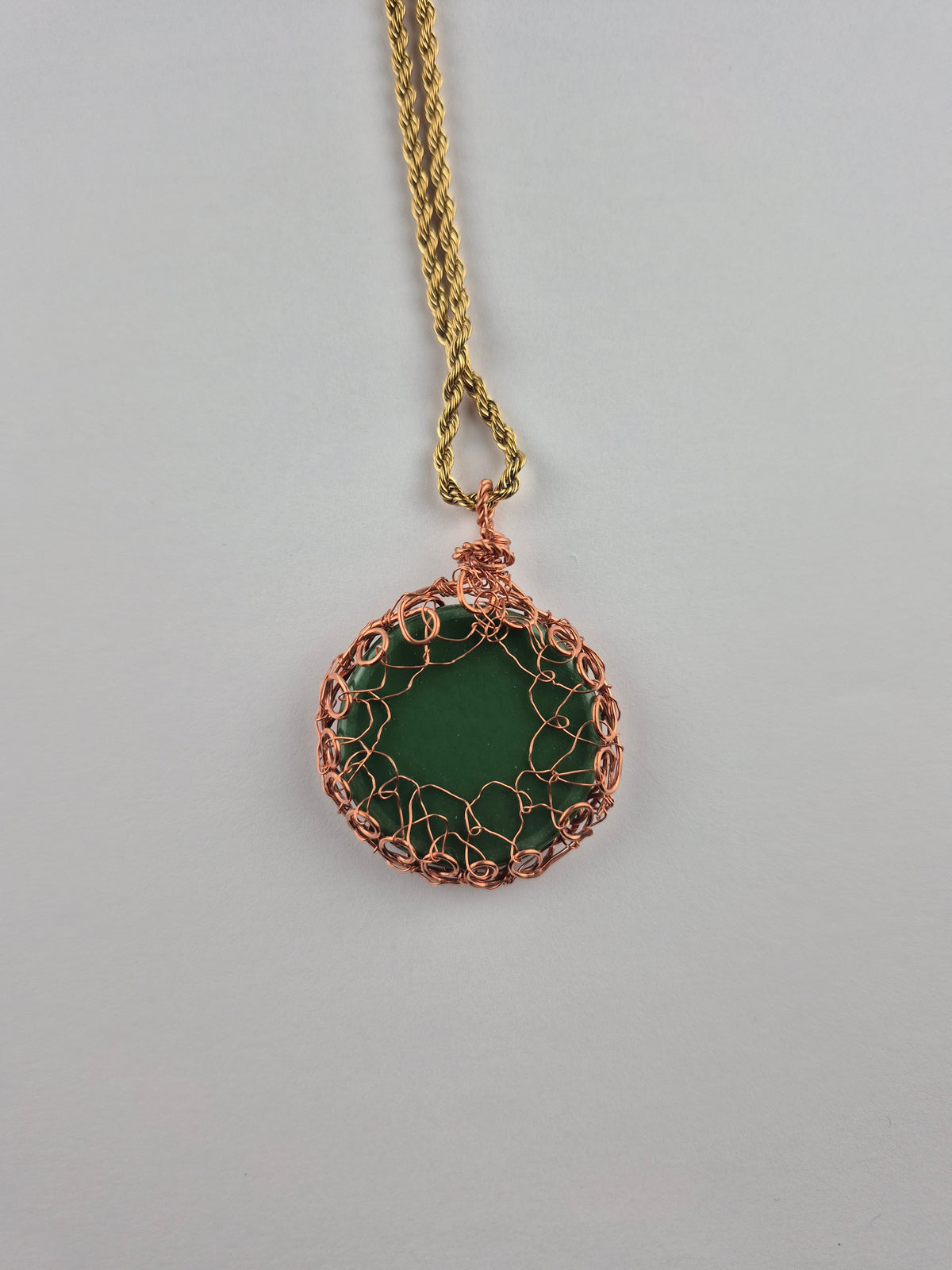 Copper wire wrapped round dichroic glass pendant